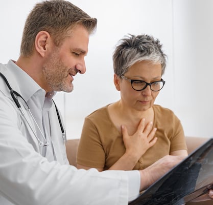 A physician reviews medical findings with a patient as part of an observational study